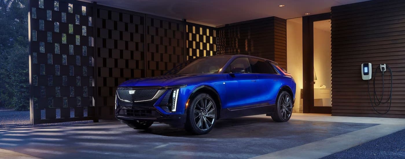 A blue 2026 Cadillac LYRIQ parked on a driveway.