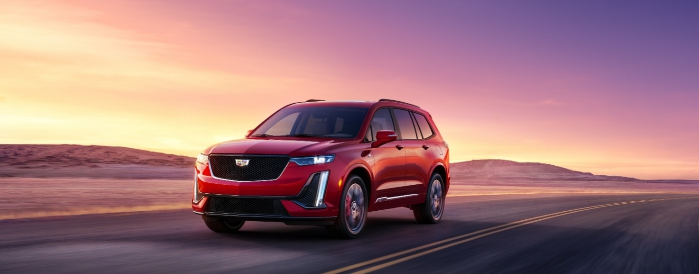 A red 2025 Cadillac XT6 from the front after leaving a Cadillac dealer near Hialeah.