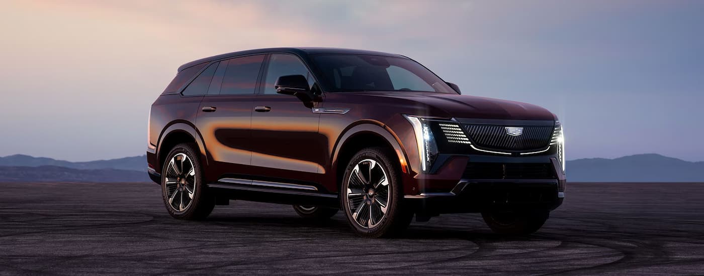Maroon 2026 Cadillac Escalade IQ for sale in Miami parked in an open area