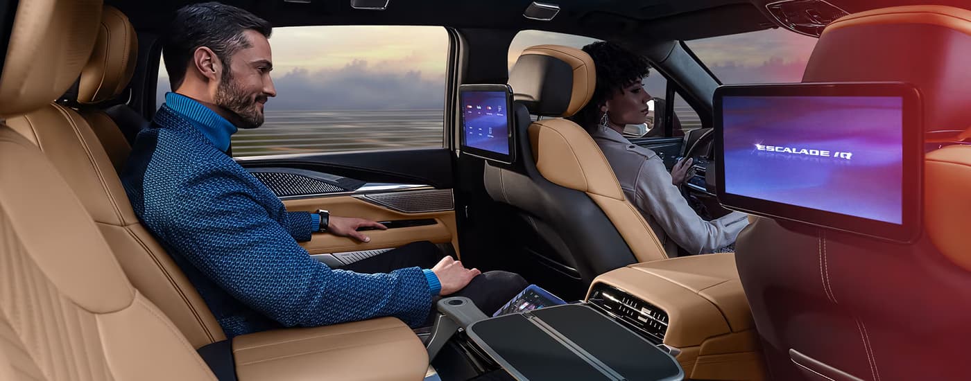 Man sitting in the backseat of a 2026 Cadillac Esclade IQ