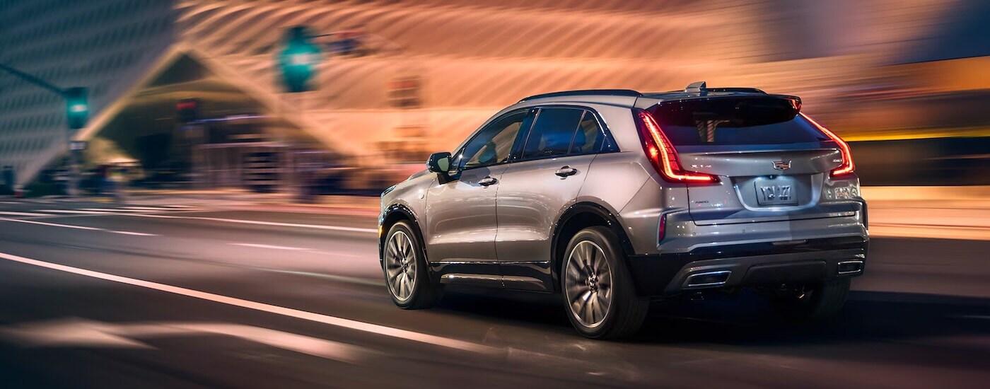 A grey 2025 Cadillac XT4 from the rear.