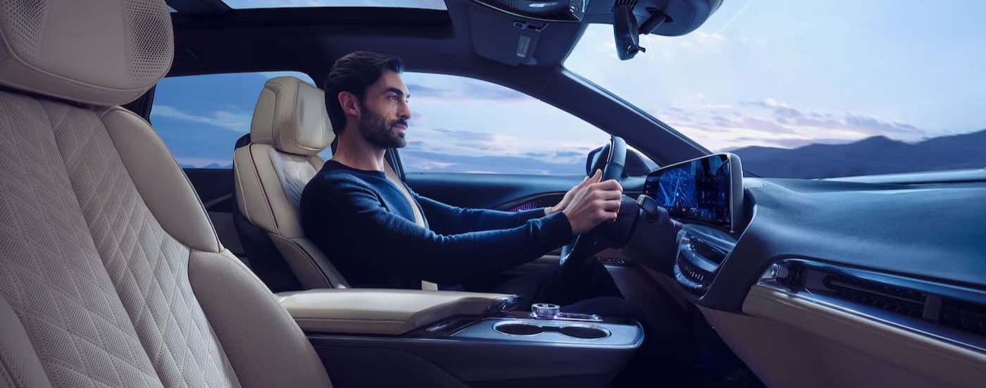 A person driving in a 2026 Cadillac LYRIQ for sale in Miami.