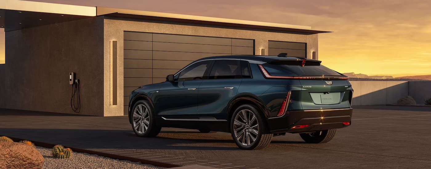 Green 2023 Cadillac LYRIQ parked in a driveway.
