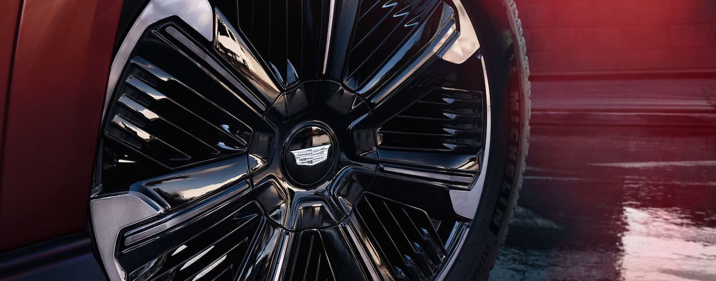 Rim and tire on a maroon 2026 Cadillac Escalade IQ