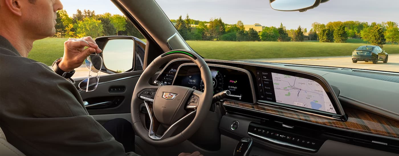 Man using testing driving a used 2023 Cadillac Escalade for sale near Dania Beach