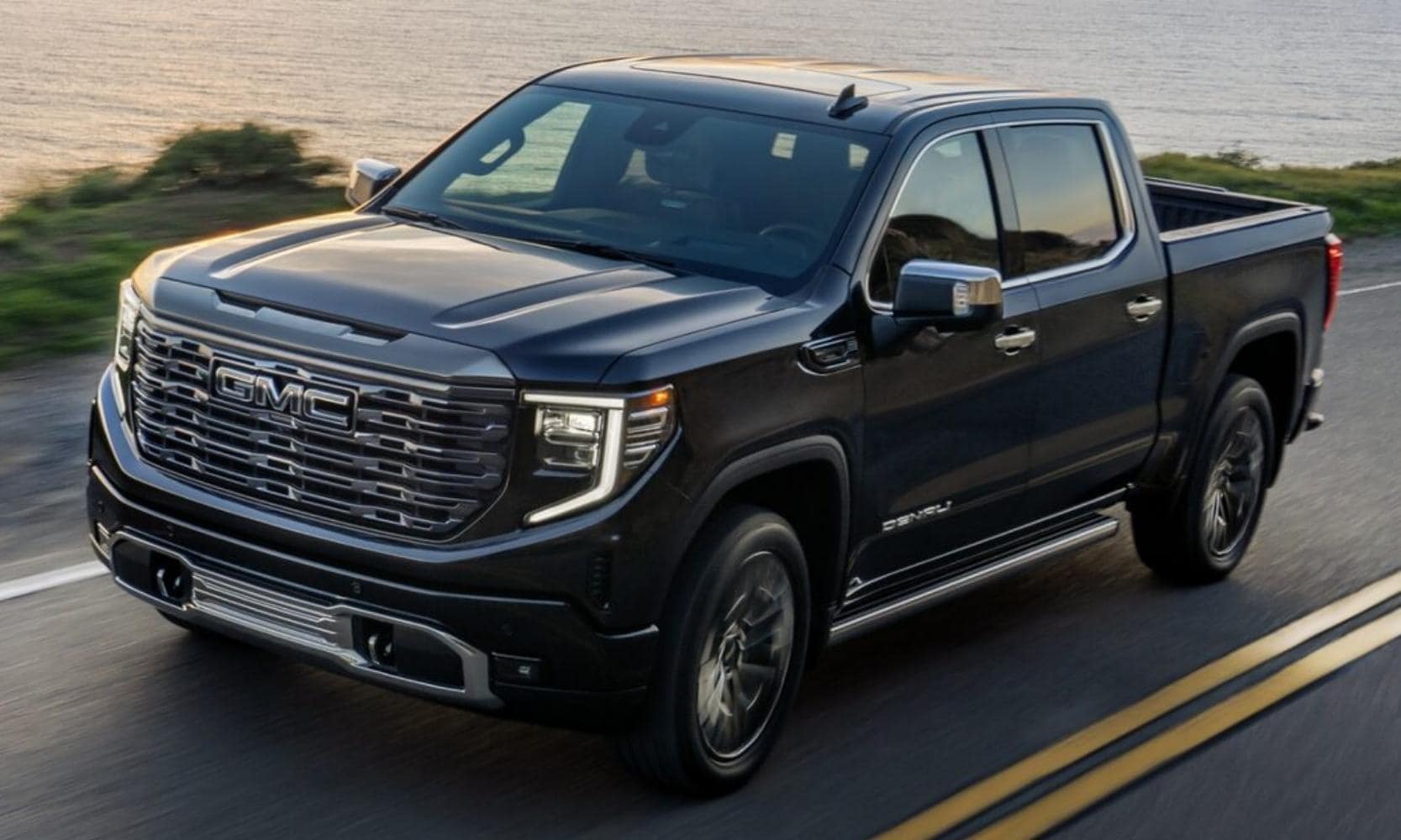 New 2023 GMC Sierra 1500 Denali Ultimate Edition driving down a highway
