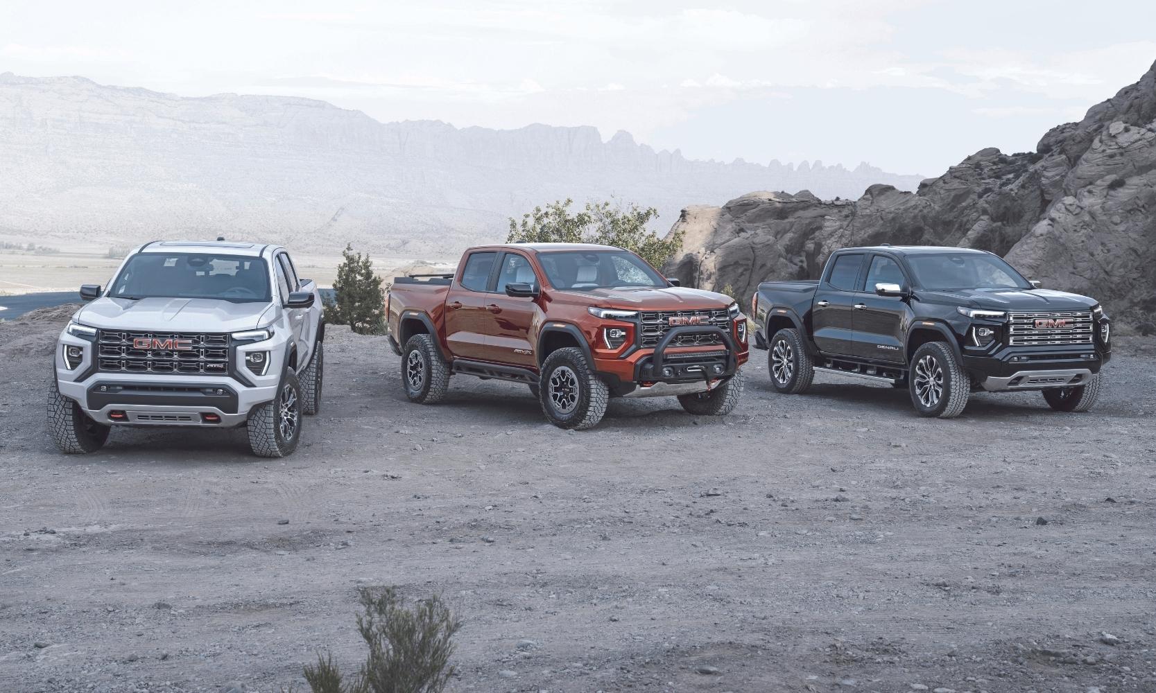 Image of a 2023 GMC Canyon AT4, AT4X, and Denali lined up in a row