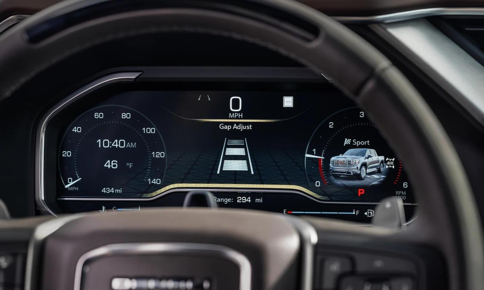 Close up view of the digital instrument panel behind the steering wheel inside the New 2023 GMC Sierra 1500