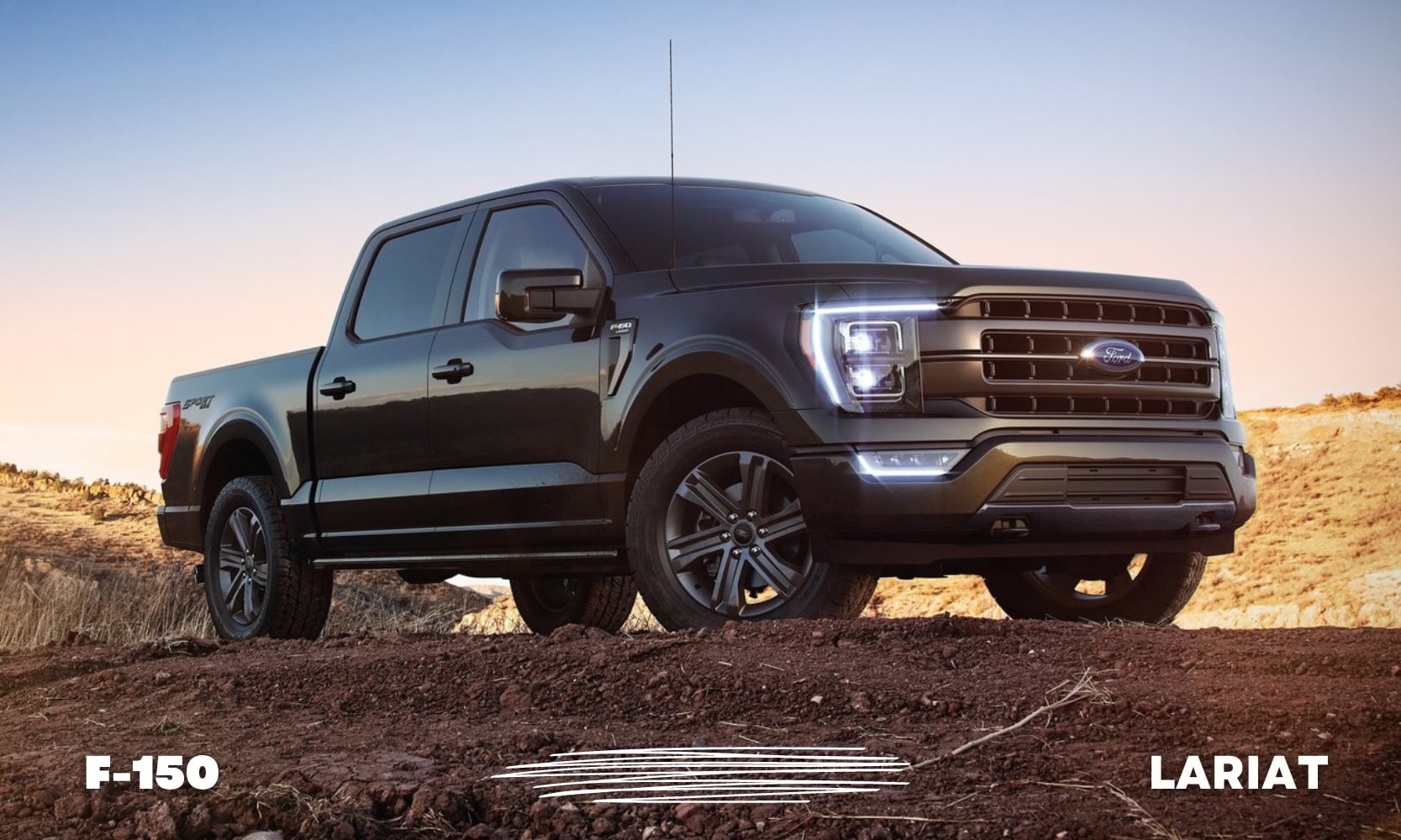 a black used Ford F-150 Lariat parked on top of a dirt mound