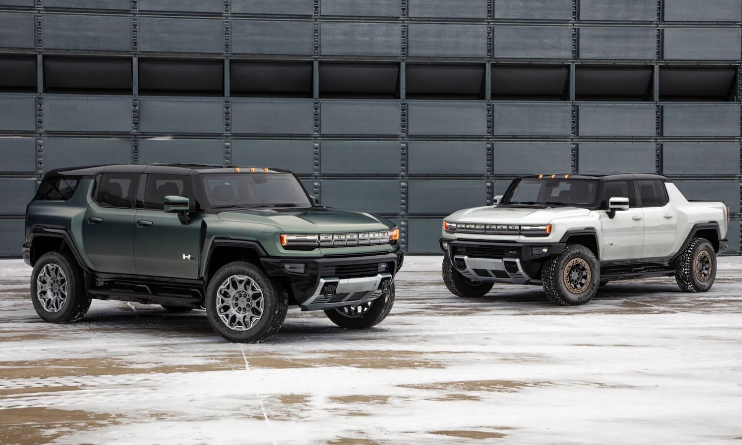 Exterior comparison of the 2022 GMC Hummer EV Truck on the right next to the 2024 GMC Hummer EV SUV on the left