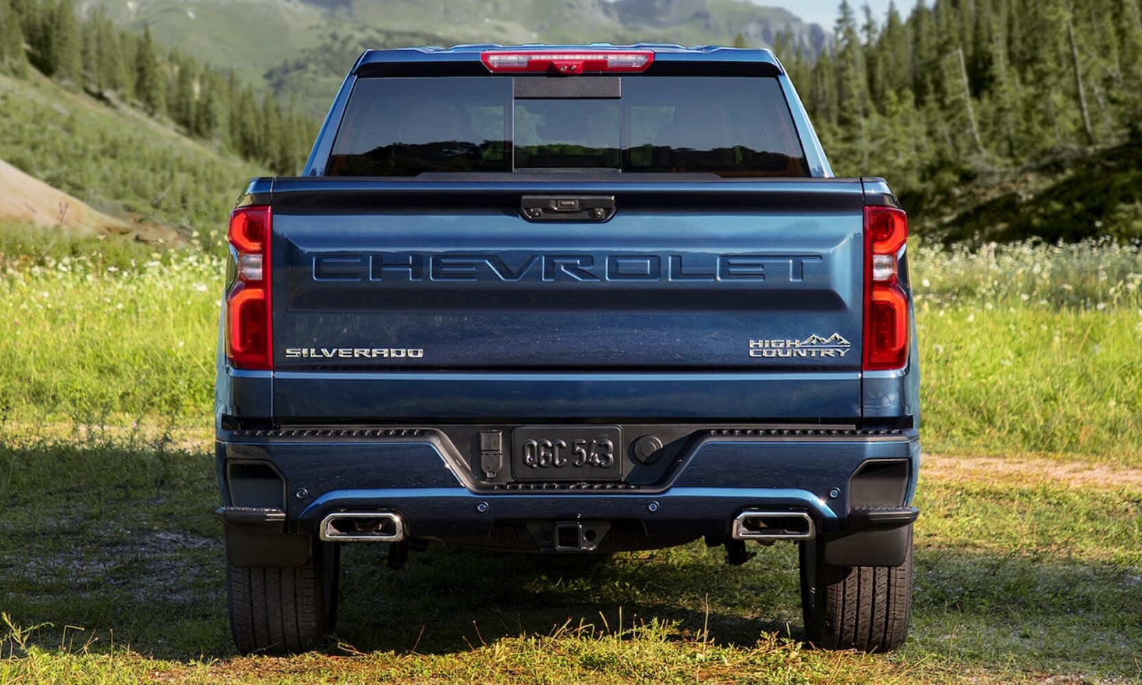 Rear exterior tailgate view of the new 2022 Chevy Silverado 1500 High Country truck with dual exhaust tips
