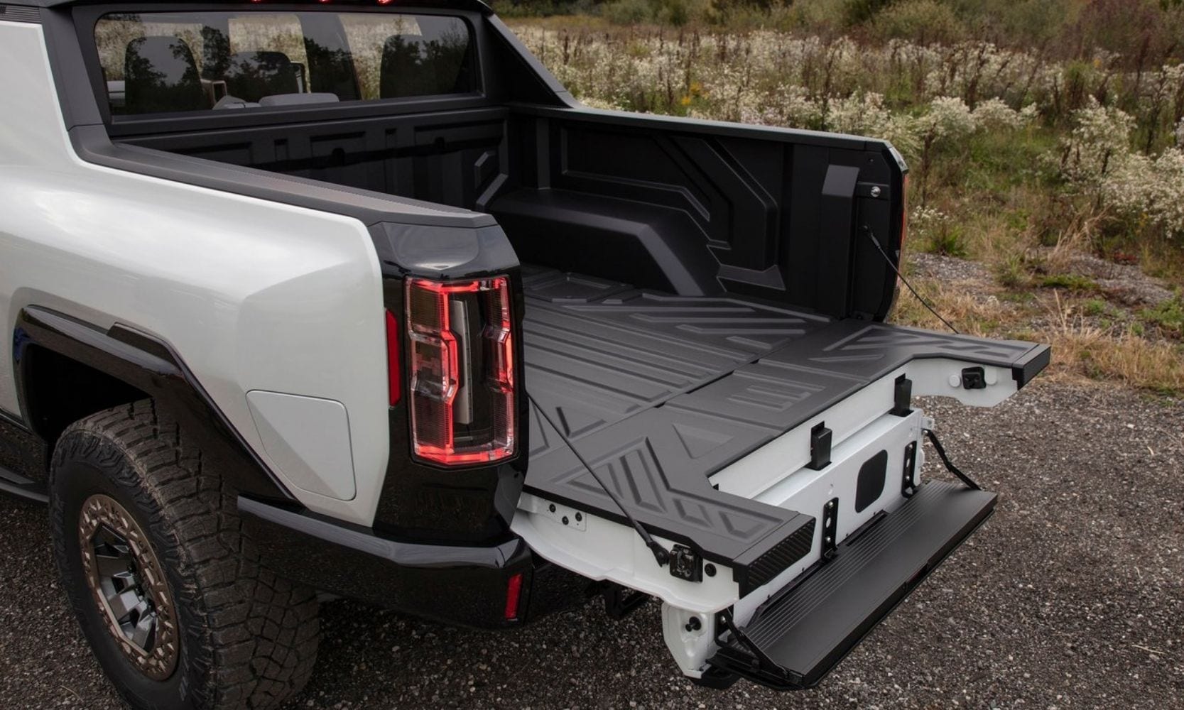Truck bed of the 2022 GMC Hummer EV showing the Multipro tailgate