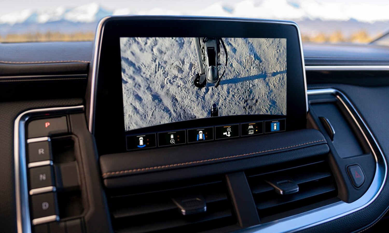 Close up view of the touchscreen infotainment display while using the towing assist technology through the rearview camera to attach the trailer to the hitch