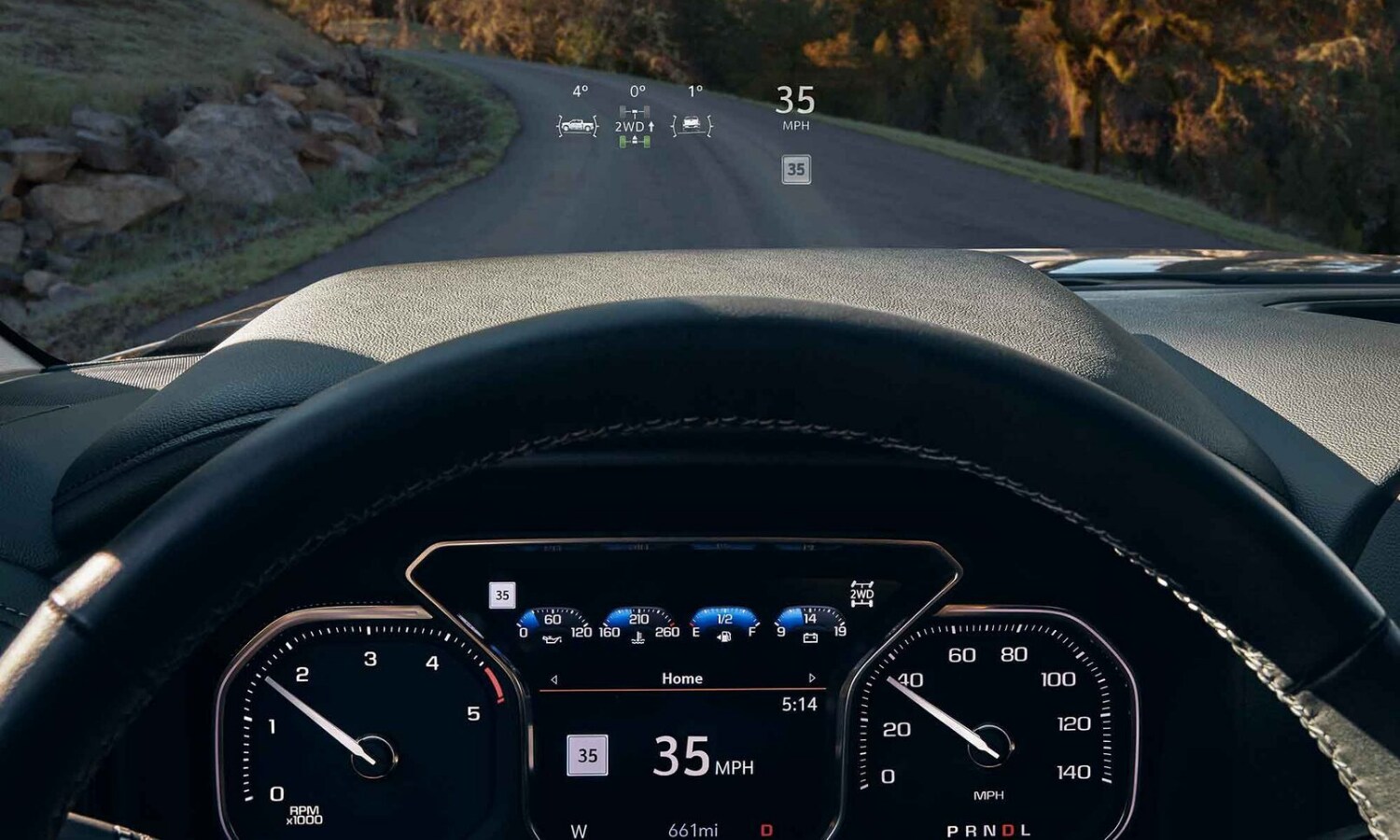 Driver eye view of the interior display behind the steering wheel and head up display inside the new 2022 GMC Sierra HD trucks