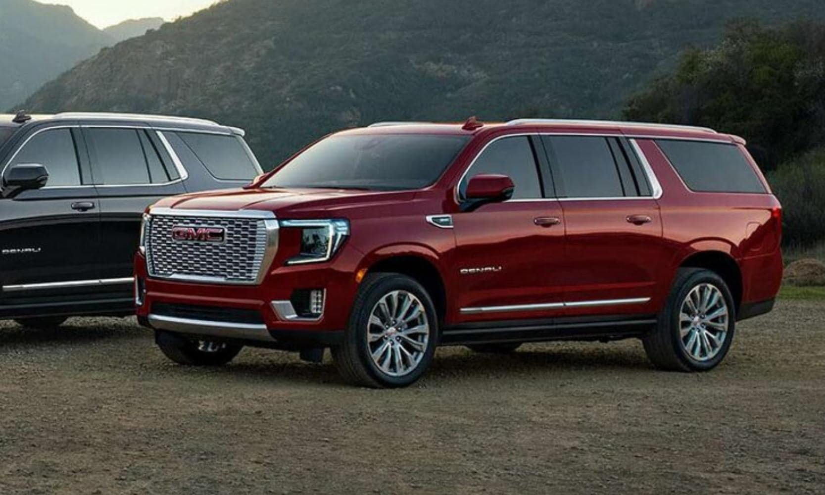 Exterior driver side view of the new 2023 GMC Yukon XL in red color