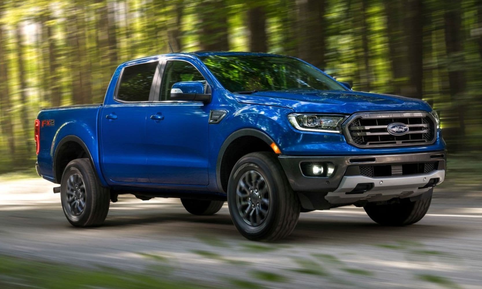 Ford Ranger Lariat speeding down an open country road
