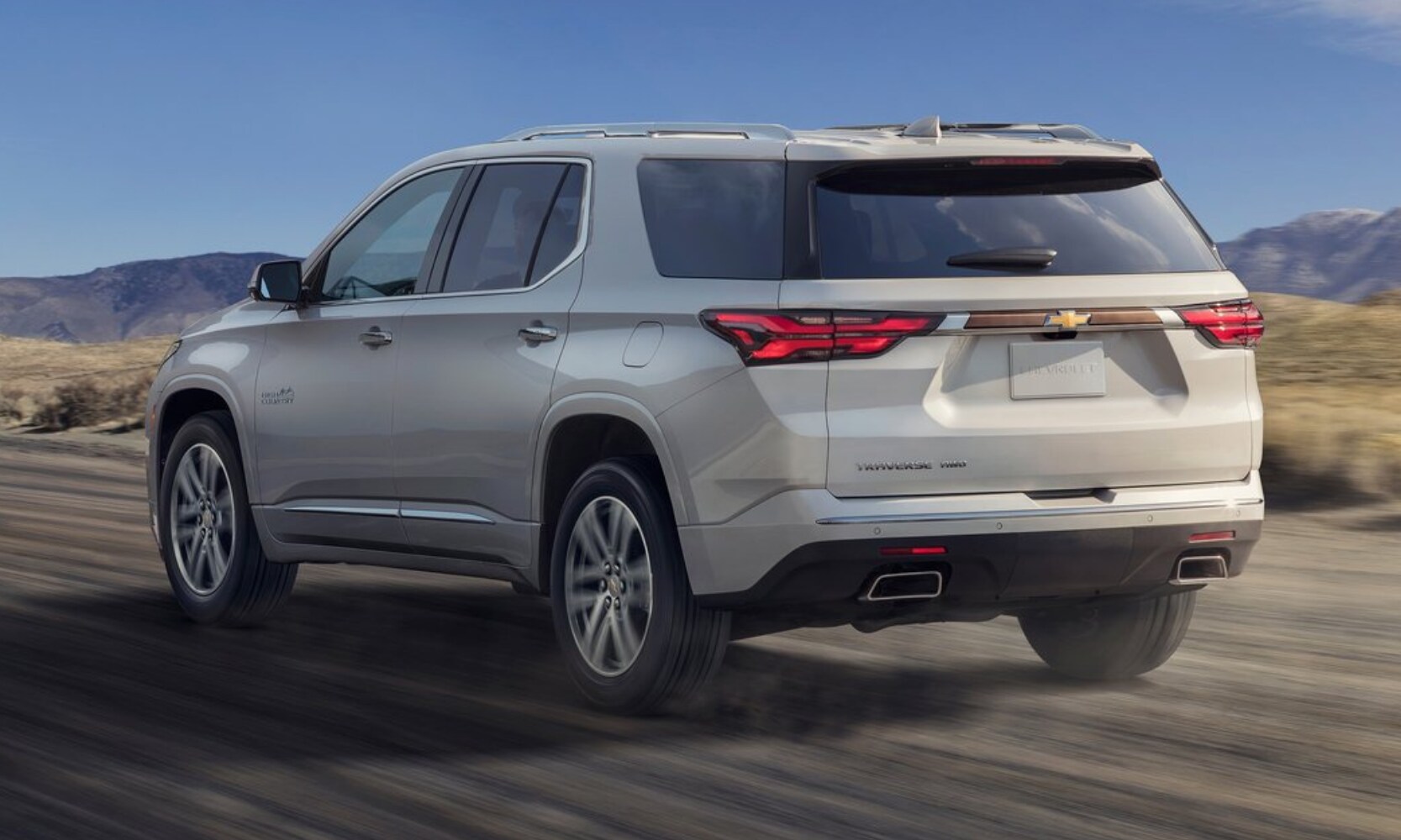 Rear side view of a 2022 Chevy Traverse in silver exterior color