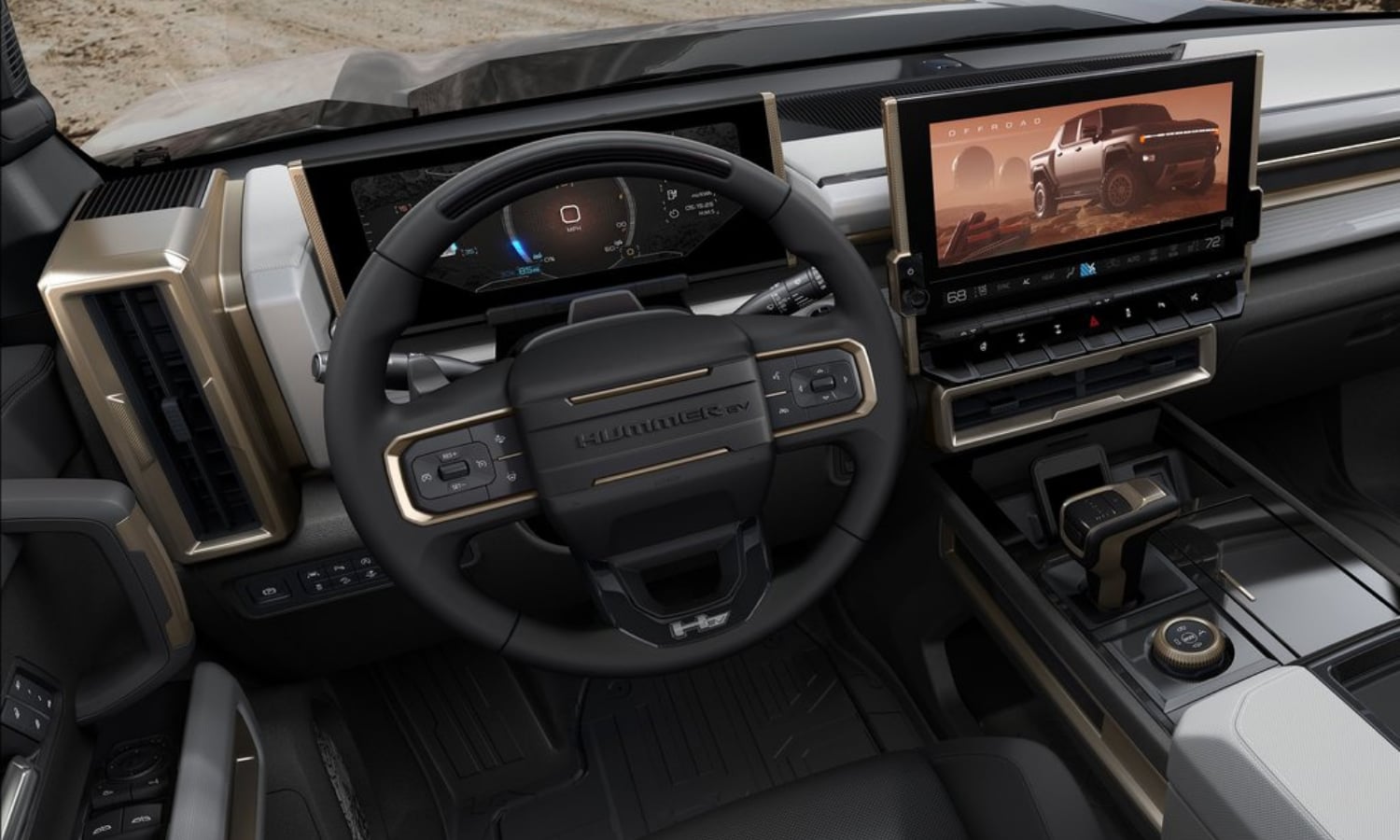 Close up driver's eye view of the interior technology behind the steering wheel and on the dashboard inside the 2022 GMC Hummer EV Truck
