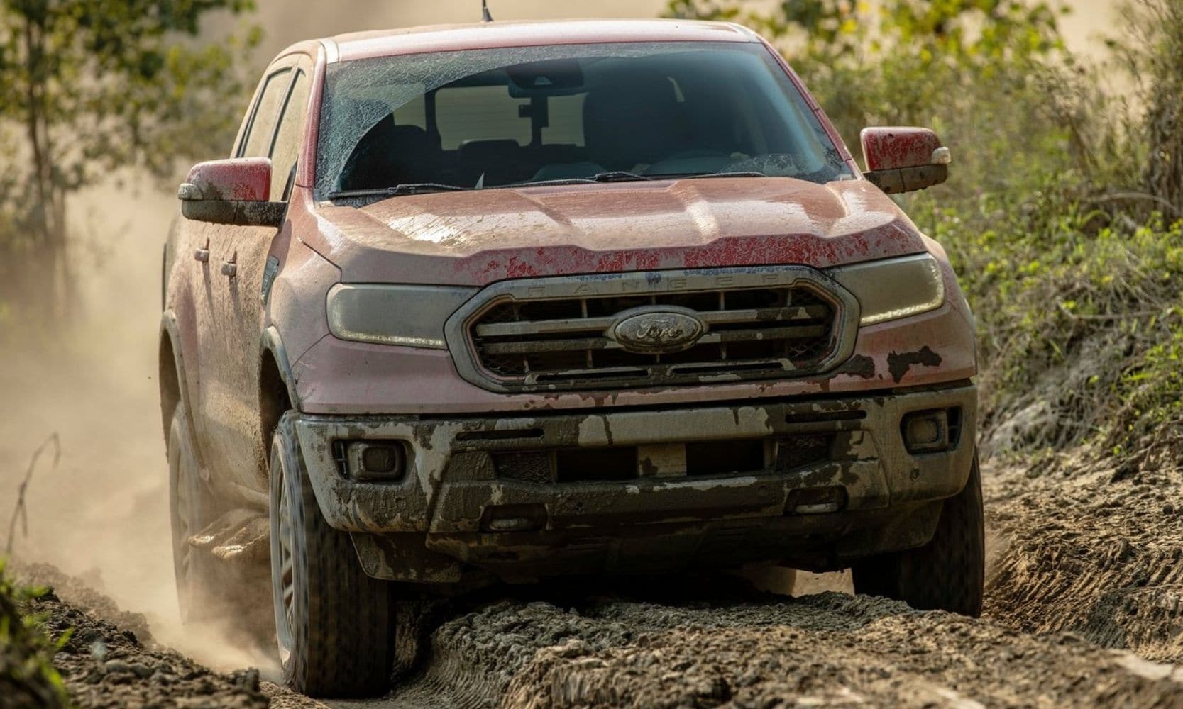 Ford Ranger Tremor on off-road trail covered in mud