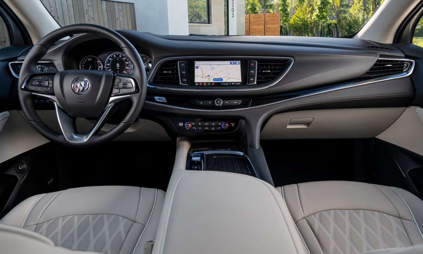 Front interior dashboard and infotainment system inside the new 2022 Buick Enclave