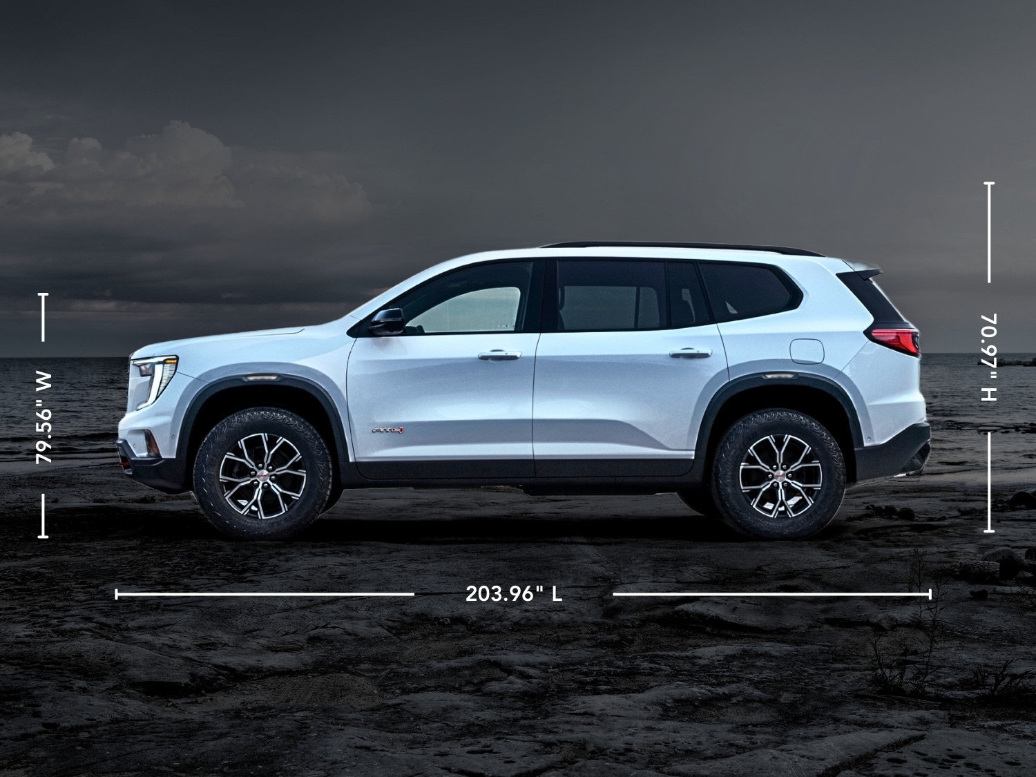 exterior side view of a white 2025 GMC Acadia with exterior dimensions written on the image around the vehicle