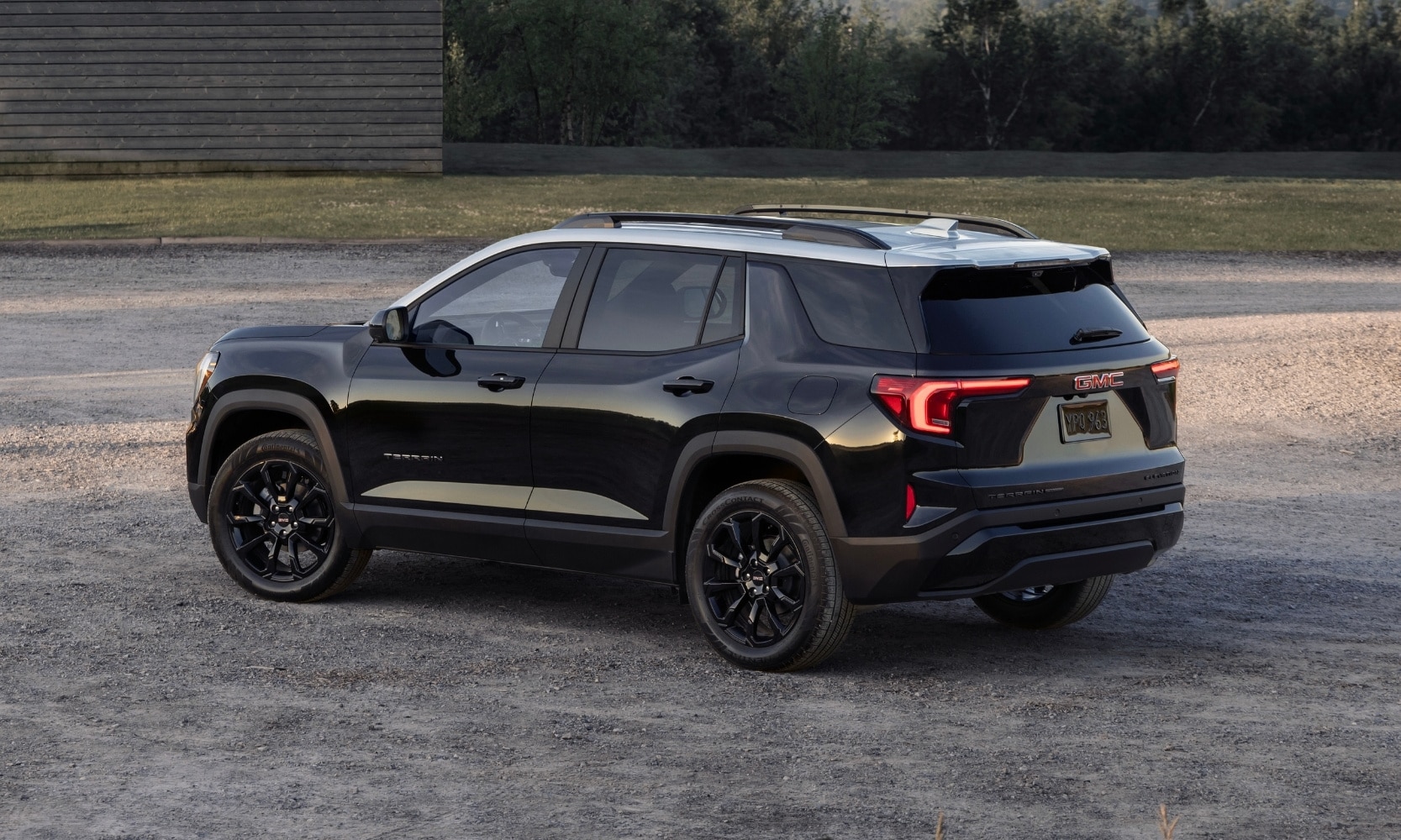 rear driver side view of a black 2025 GMC Terrain Elevation SUV