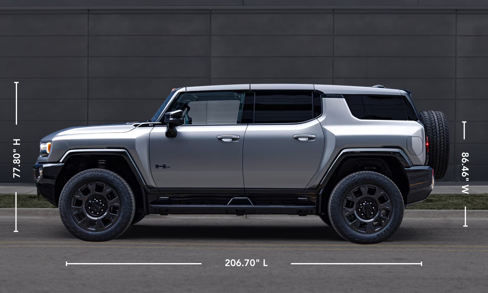 Exterior side image graphic of a silver 2026 GMC Hummer EV SUV parked on a freeway with its specs displayed