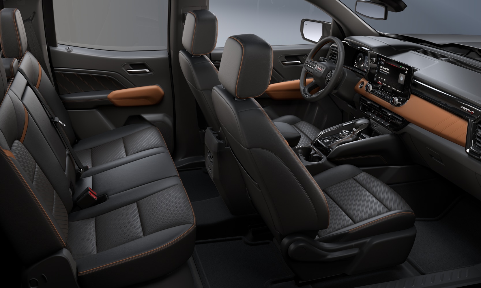 Interior side-view image of a 2026 GMC Canyon AT4 two-seat rows with black leather and tan accents