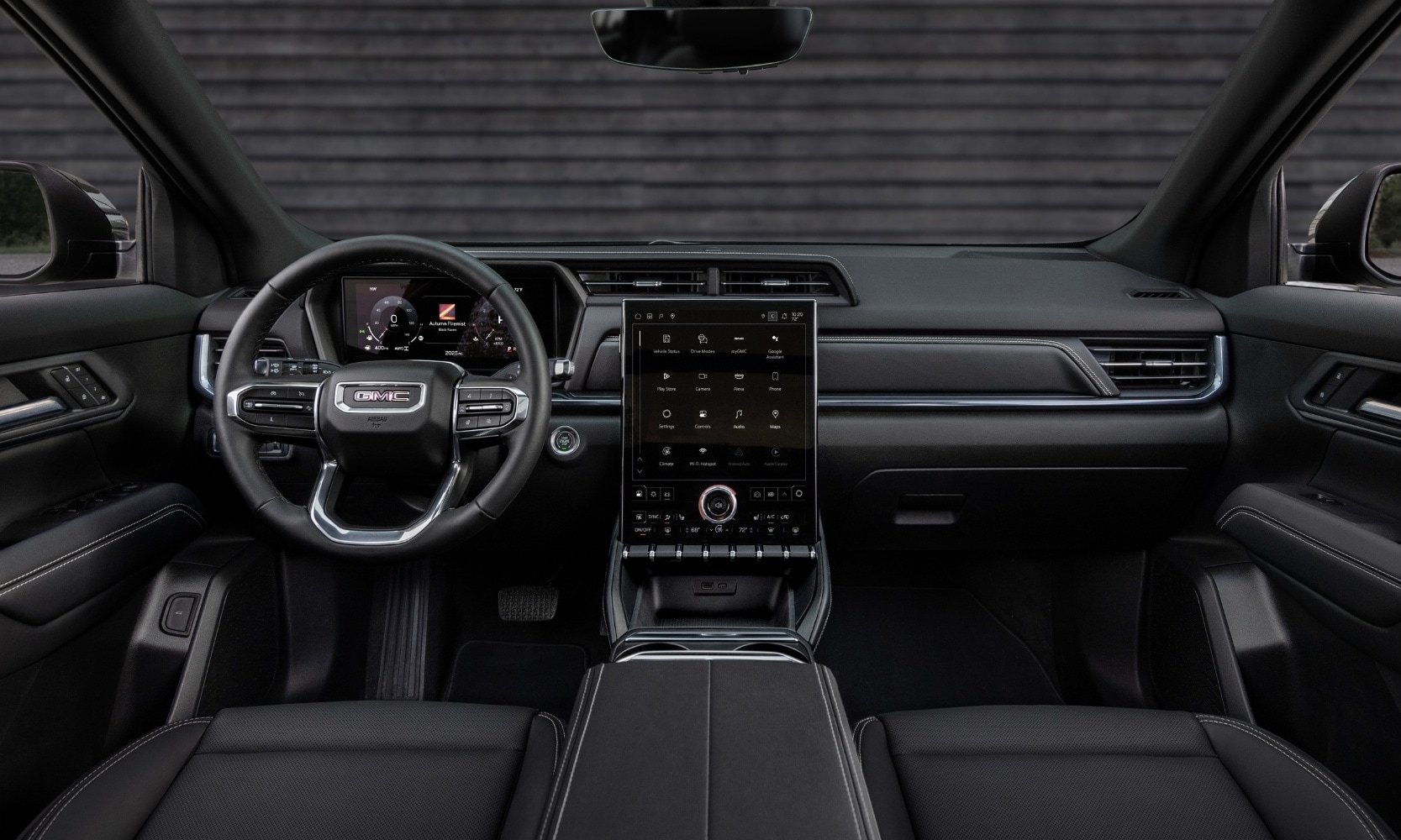 interior front dashboard, steering wheel, and infotainment system inside the 2025 GMC Terrain Elevation