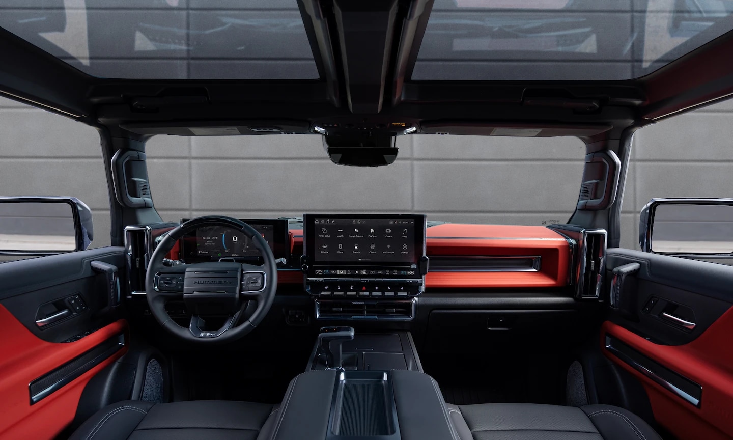 Interior image of a 2026 GMC Hummer EV SUV red orange and gray front seating area