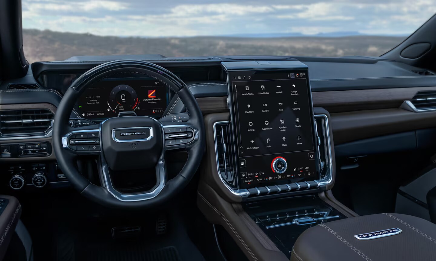 Interior image of the 2026 GMC Yukon front row area and infotainment system