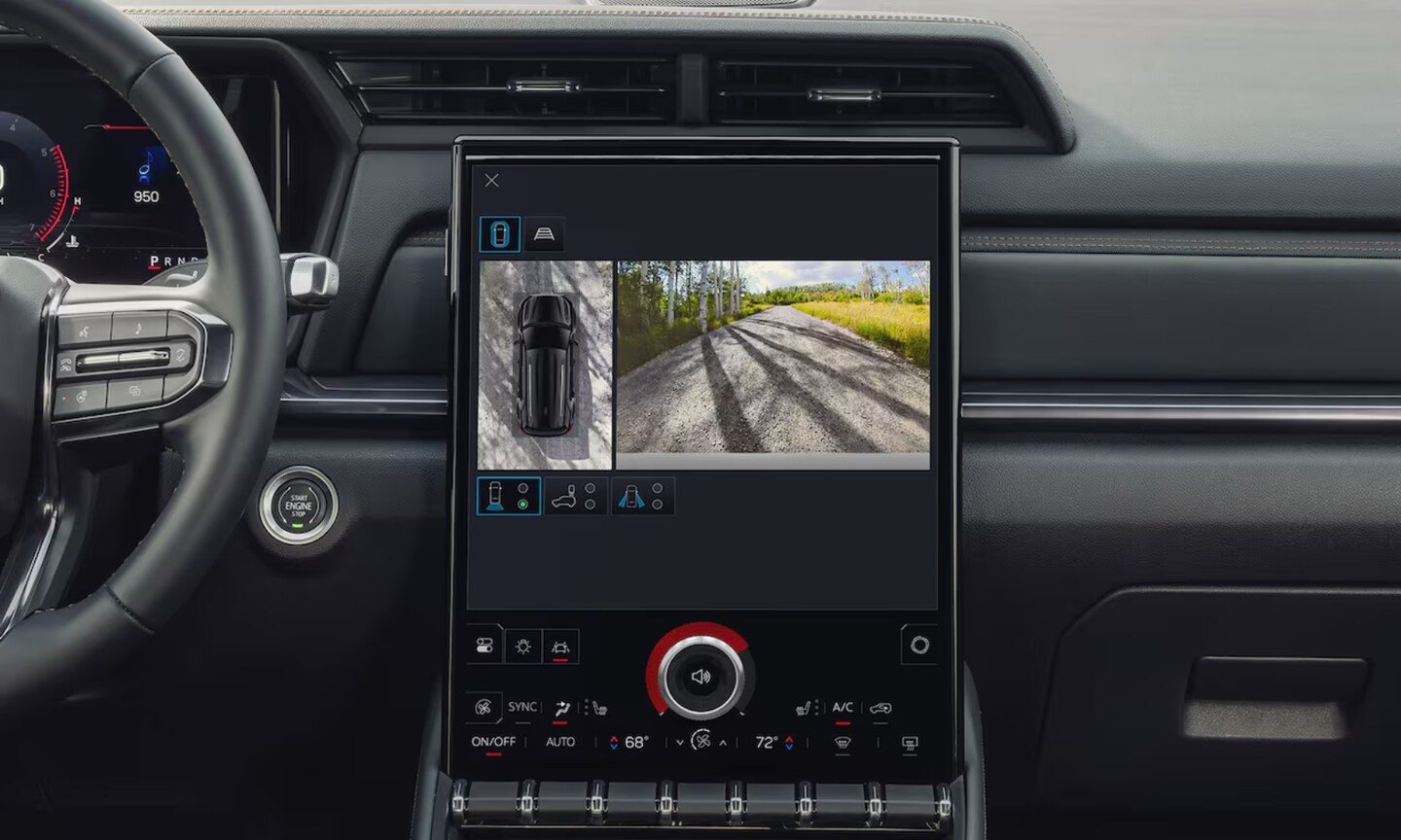 Closeup interior image of the 2026 GMC Terrain camera system on its dashboard with bird's eye vehicle views