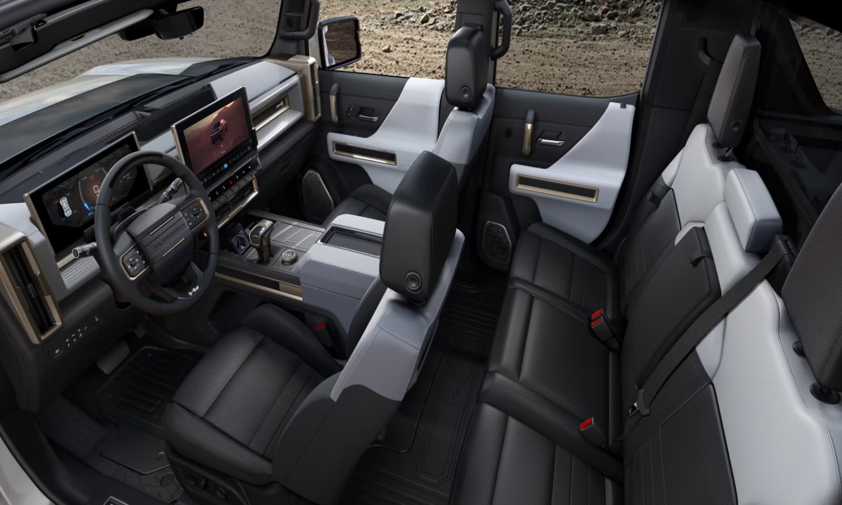 Top-view interior image of the 2025 GMC Hummer EV Pickup Truck's two rows, gray and black leather seats, and dashboard area