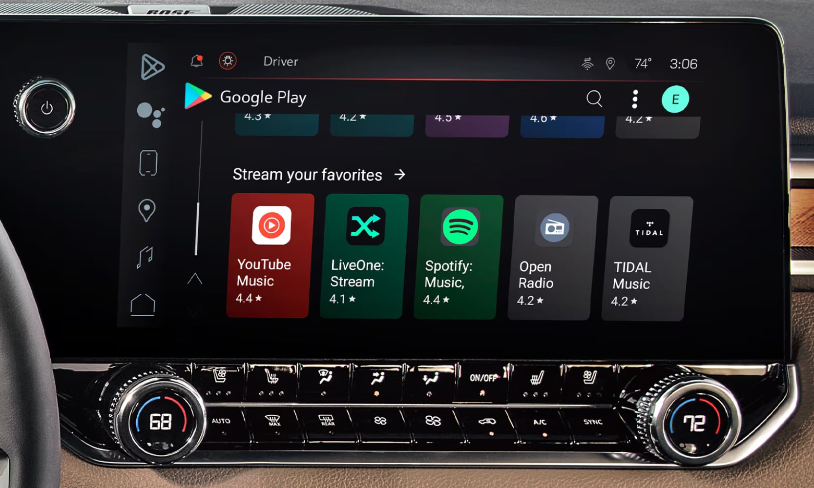 Closeup image of a 2026 GMC Canyon Denali's infotainment system on a wood trim dashboard