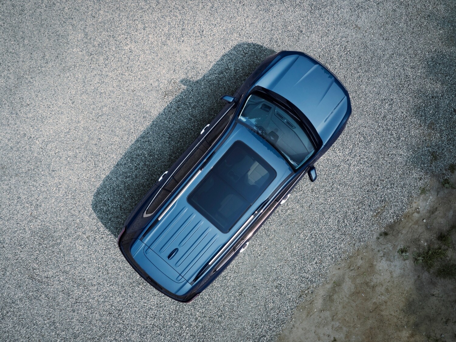 aerial exterior view of a 2025 GMC Acadia Denali model with a sun roof