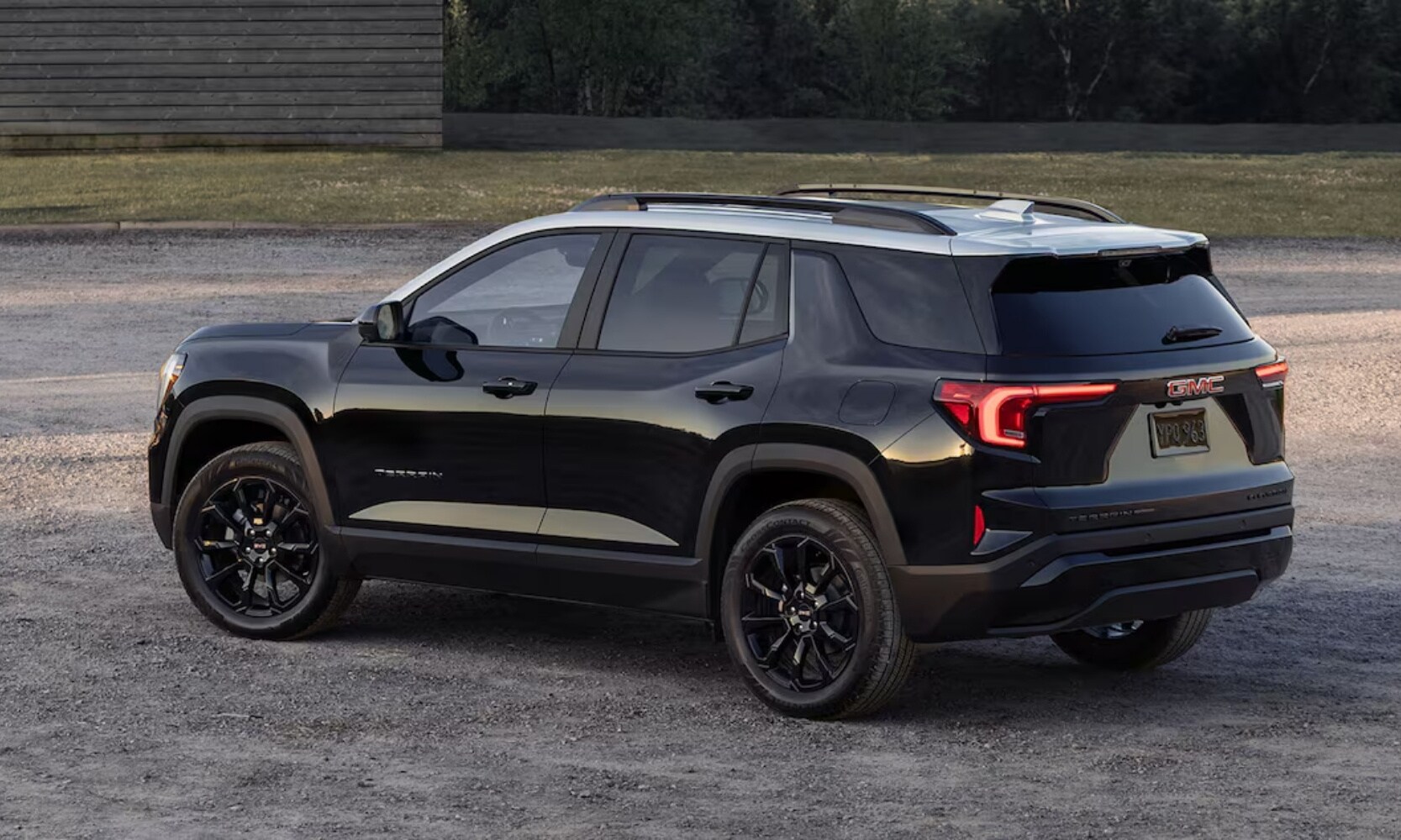 Exterior side image of the 2025 GMC Terrain Elevation Black Edition outside on a gravel lot