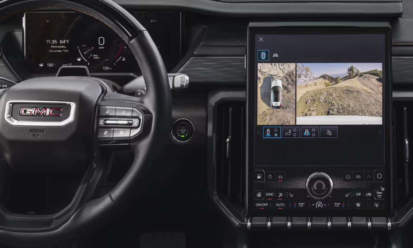 Close-up image of the 2025 GMC Acadia HD Surround Vision safety technology on the infotainment screen next to the steering wheel