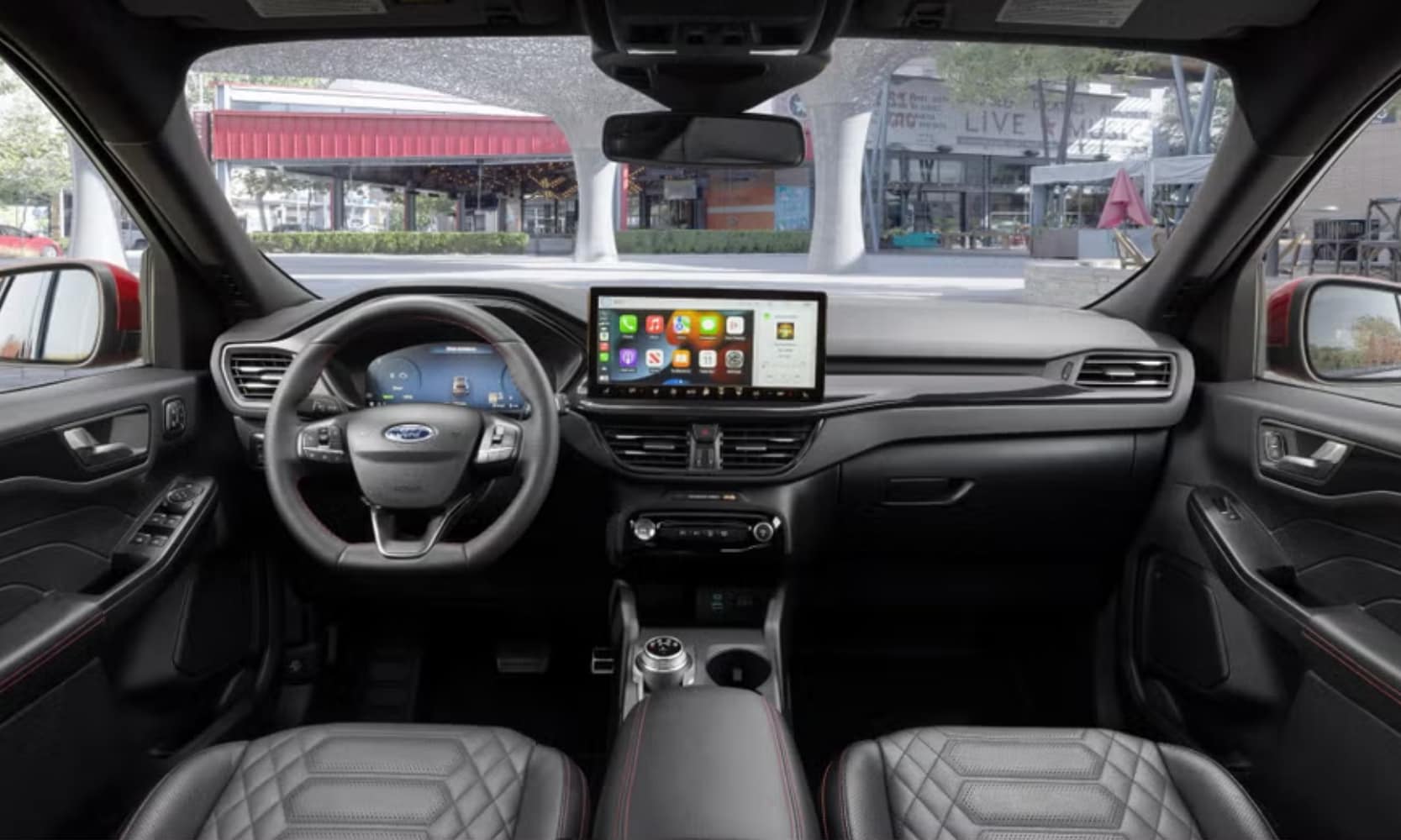 Interior image of the 2023 Ford Escape ST-Line Elite dashboard, front seats, and infotainment system