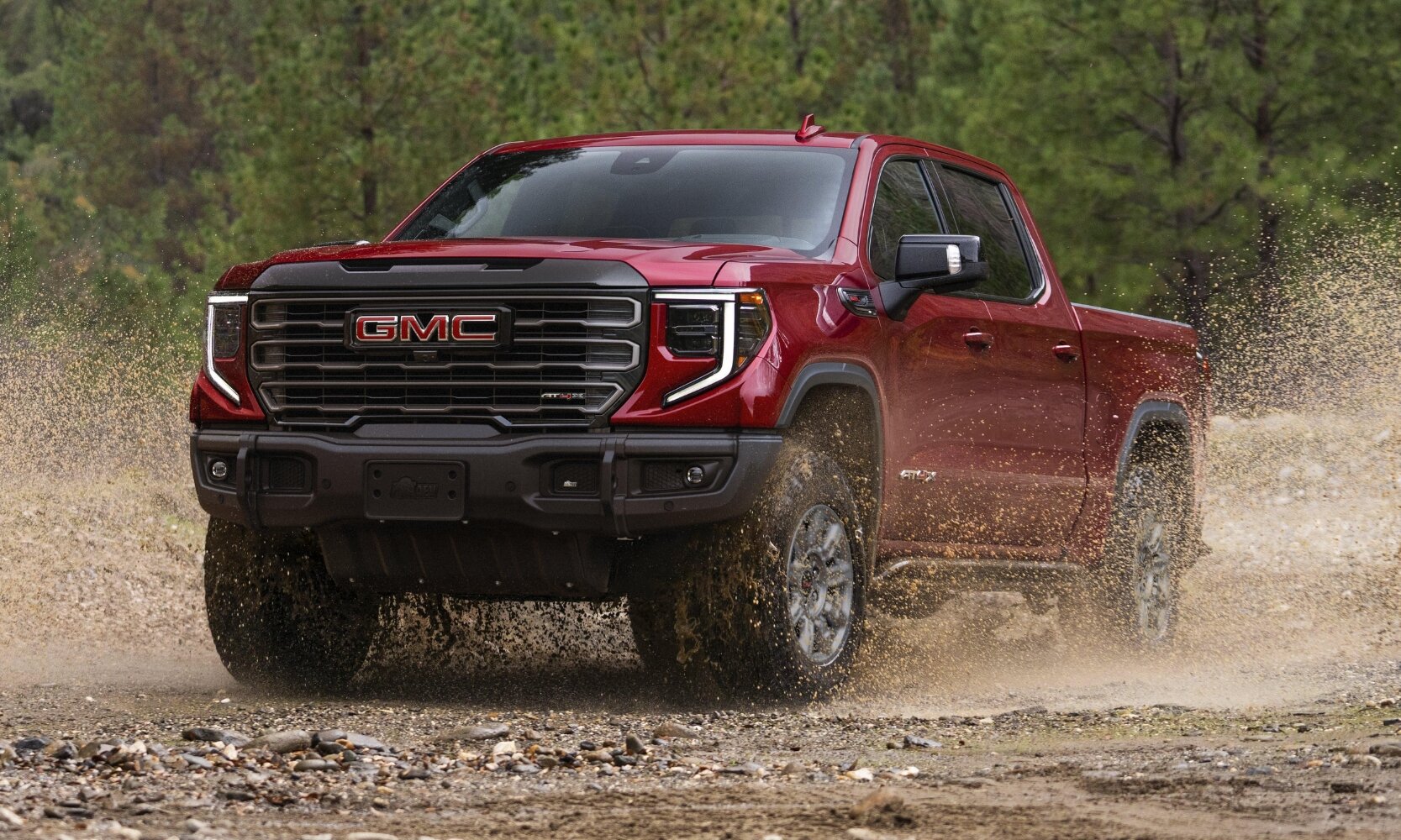 Comparison image of the 2024 GMC Sierra 1500 AT4X exterior