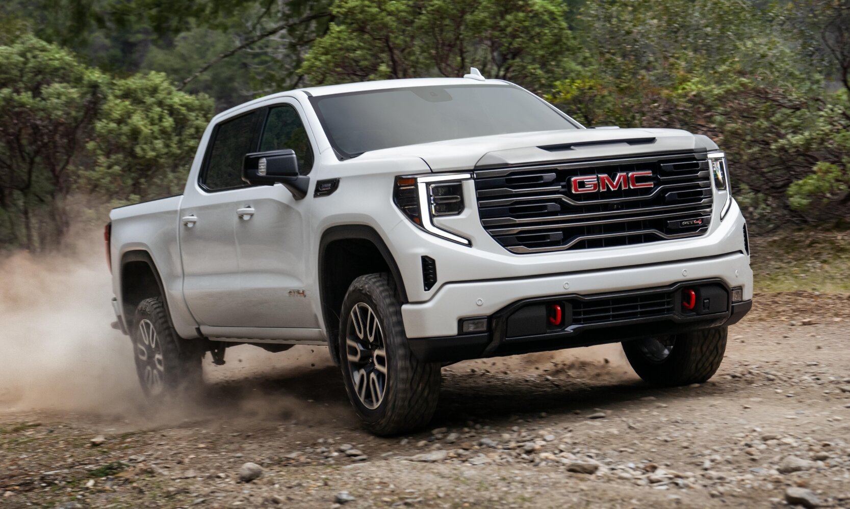 Comparison image of the 2024 GMC Sierra 1500 AT4 exterior