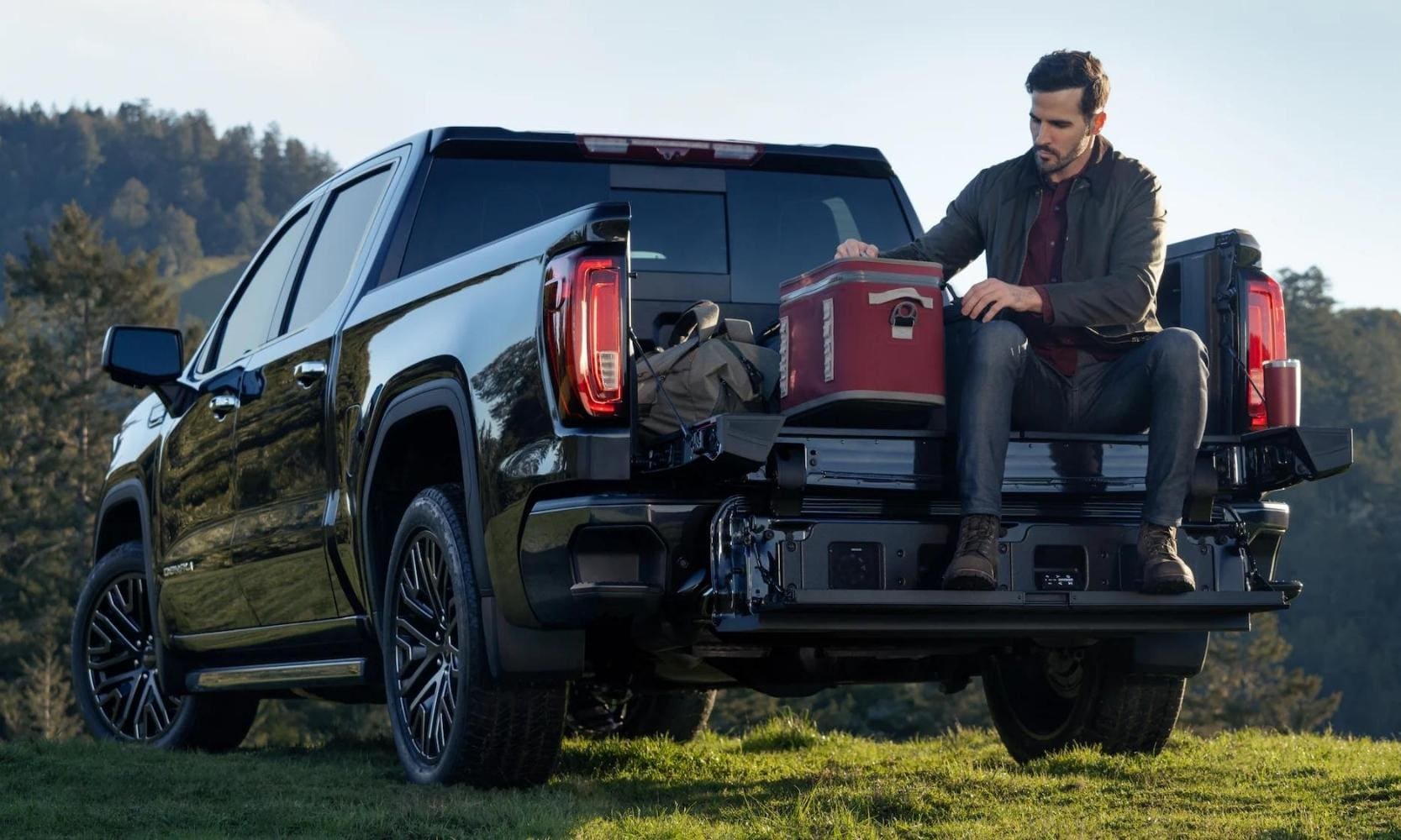 2022 GMC Sierra 1500 Denali Ultimate multipro tailgate in use by the driver