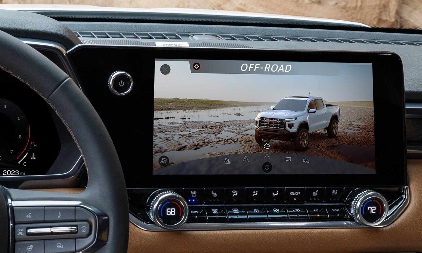 Close up view of the infotainment display inside the 2024 GMC Canyon showing the Off-Road traction mode on-screen
