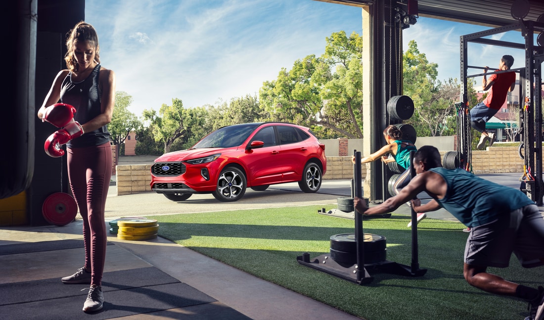 2024-Ford-Escape-STLineElite-SUV-L01.png red Ford Escape parked in front of a garage home gym