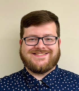 Staff member Christopher Ballis from ID_98299f79a16a