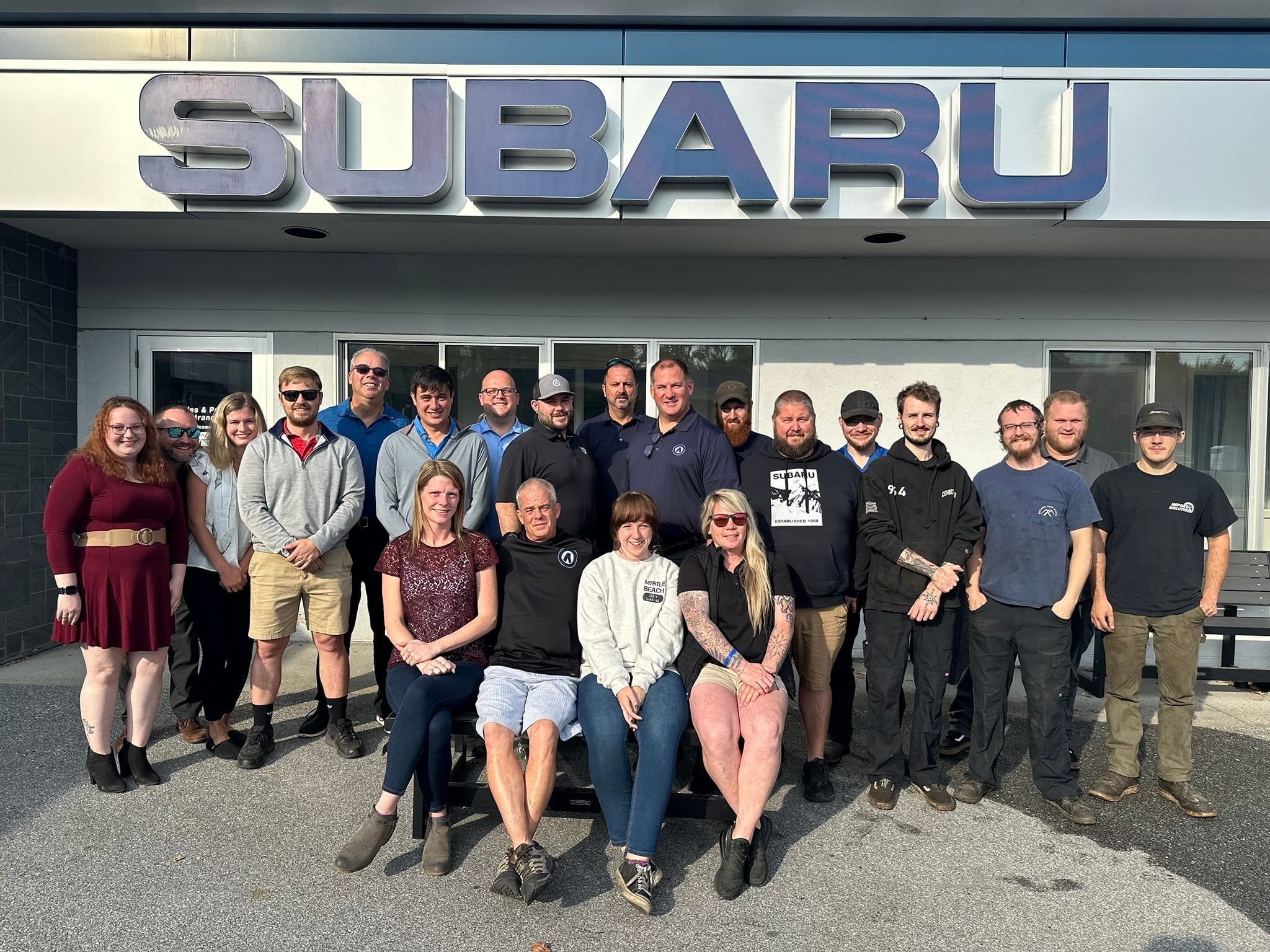  Person cheerfully signing documents.