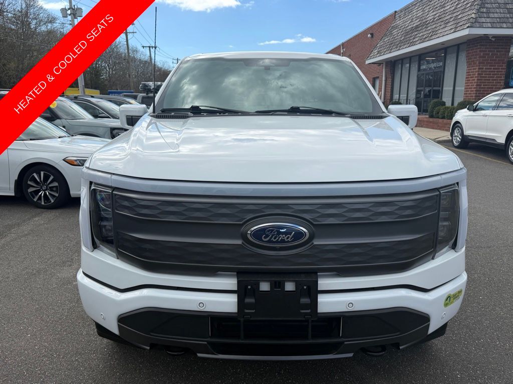 Certified 2023 Ford F-150 Lightning Lariat with VIN 1FT6W1EV4PWG11482 for sale in Quogue, NY