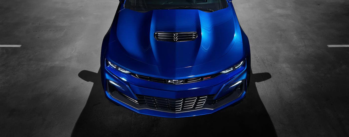 Overhead view of a shiny blue 2022 Chevy Camaro SS parked at a Chevrolet dealer in Marlow Heights.