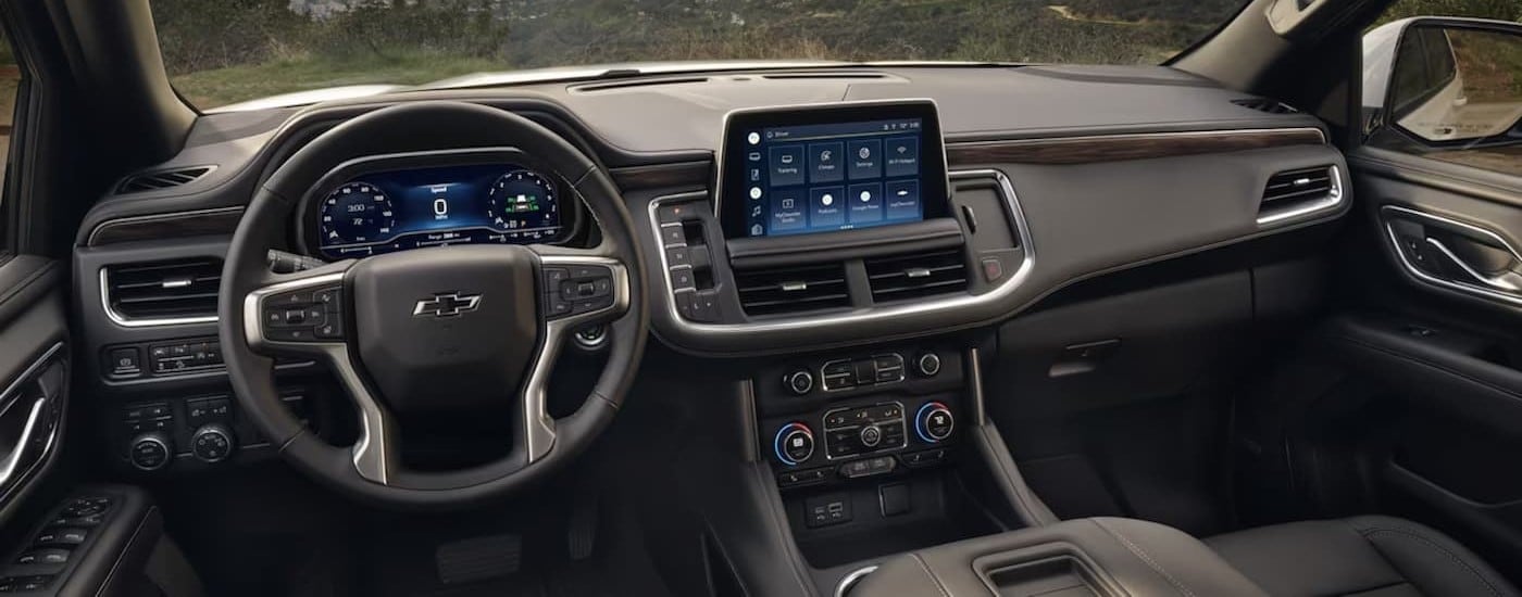  The black interior and dash of a 2024 Chevy Tahoe is shown.