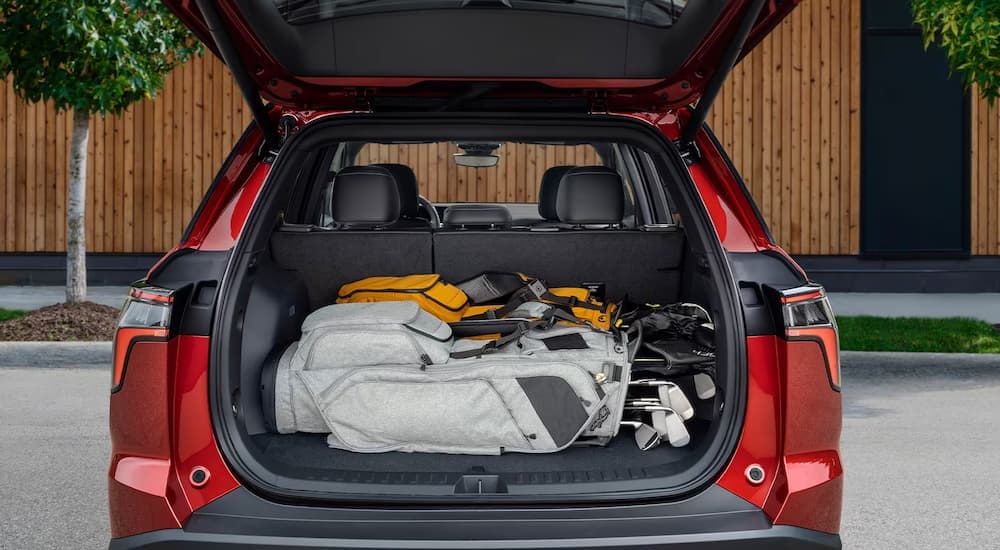 Cargo shown in the rear of a red 2025 Chevy Equinox RS.