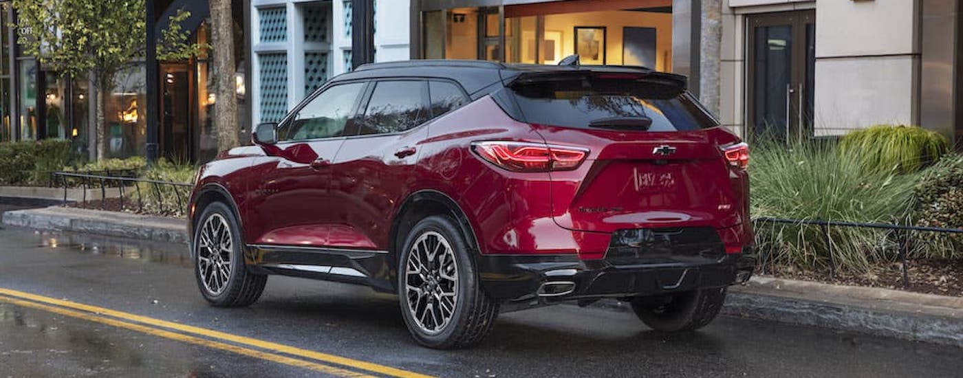 A red 2024 Chevy Blazer RS is shown from the rear at an angle.